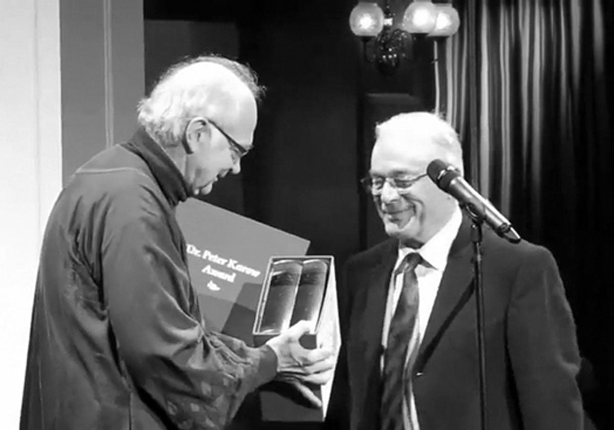 Donald Knuth receiving the PKA from Peter Karow